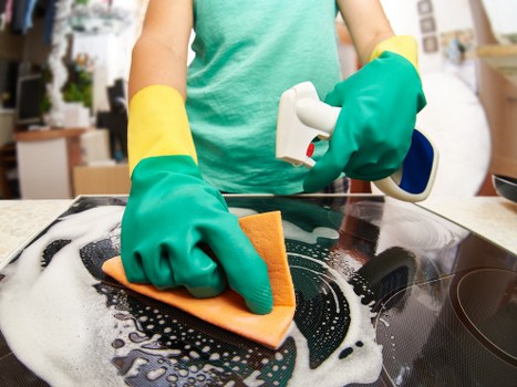 Deep cleaning bathroom surfaces during a move out clean in Hounslow